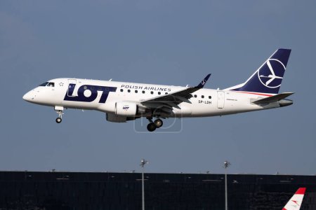 Photo for Vienna, Austria - May 13, 2018: LOT Polish Airlines Embraer ERJ-170 SP-LDH passenger plane arrival and landing at Vienna Airport - Royalty Free Image