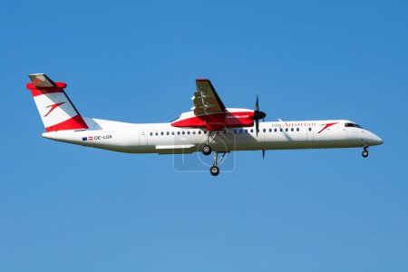 Photo for Vienna, Austria - May 13, 2018: Austrian Airlines Bombardier DHC-8 Q400 OE-LGK passenger plane arrival and landing at Vienna Airport - Royalty Free Image