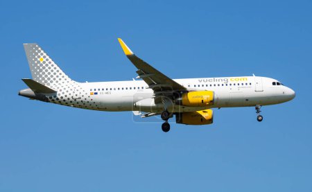 Photo for Vienna, Austria - May 13, 2018: Vueling Airlines Airbus A320 EC-MES passenger plane arrival and landing at Vienna Airport - Royalty Free Image