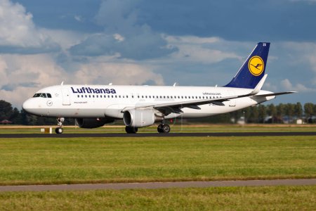 Photo for Amsterdam, Netherlands - August 15, 2014: Lufthansa passenger plane at airport. Schedule flight travel. Aviation and aircraft. Air transport. Global international transportation. Fly and flying. - Royalty Free Image