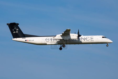 Photo for Vienna, Austria - May 20, 2018: Star Alliance Austrian Airlines Bombardier DHC-8 Q400 OE-LGP passenger plane arrival and landing at Vienna Airport - Royalty Free Image