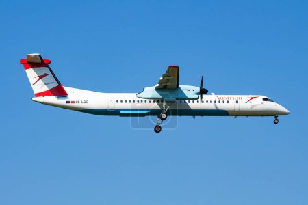 Photo for Vienna, Austria - May 13, 2018: Austrian Airlines Bombardier DHC-8 Q400 OE-LGE passenger plane arrival and landing at Vienna Airport - Royalty Free Image