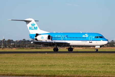 Photo for Amsterdam / Netherlands - August 13, 2014: KLM Royal Dutch Airlines Fokker 70 PH-WXD passenger plane arrival and landing at Amsterdam Schipol Airport - Royalty Free Image