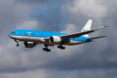 Photo for Amsterdam / Netherlands - August 14, 2014: KLM Royal Dutch Airlines Boeing 777-200 PH-BQI passenger plane arrival and landing at Amsterdam Schipol Airport - Royalty Free Image