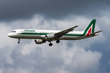 Photo for Amsterdam, Netherlands - August 14, 2014: Alitalia passenger plane at airport. Schedule flight travel. Aviation and aircraft. Air transport. Global international transportation. Fly and flying. - Royalty Free Image