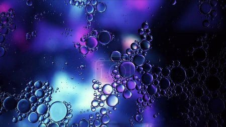 Abstracto colorido aceite de comida gotas burbujas y esferas que fluyen en la superficie del agua Macro fotografía