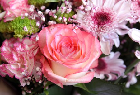 Photo for A tender bouquet of pink flA tender bouquet of pink flowers and a roseowers and a rose - Royalty Free Image