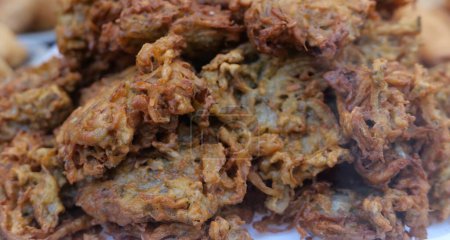 Photo for Full frame image of pile of crispy fried onion bhajis. High quality photo - Royalty Free Image