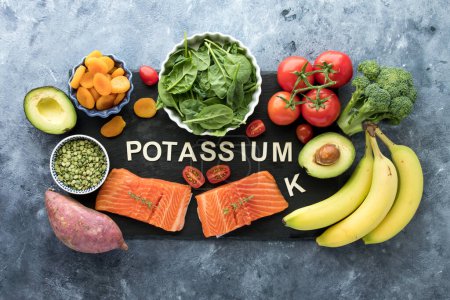 Photo for An assortment of foods high in potassium with the chemical element symbol K for potassium. - Royalty Free Image