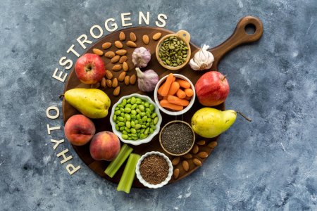 Photo for Top down view of a board topped with foods high in phytoestrogens. A nutritional concept. - Royalty Free Image