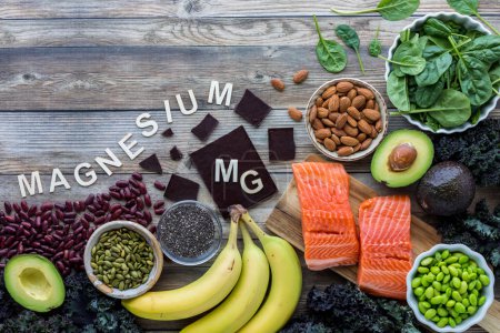 Photo for An assortment of foods high in the essential mineral magnesium with copy space above. - Royalty Free Image