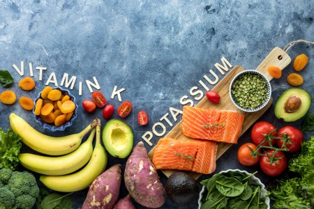 Photo for Top down view of foods high in the essential mineral potassium with copy space above. - Royalty Free Image