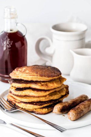 Photo for A freshly made stack of sweet potato pancakes ready for syrup to be poured on top. - Royalty Free Image