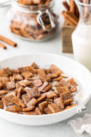 Photo for A bowl of homemade low carb cinnamon toast crunchy cereal with milk, ready for eating. - Royalty Free Image