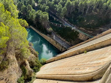 Photo for Panoramic view of a dam in a reservoir, in Guadalest village, Spain. The floodgates are open. - Royalty Free Image