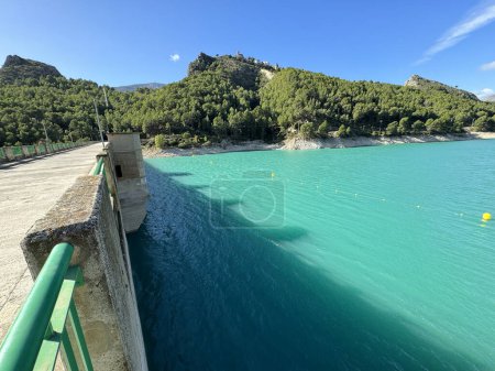 Photo for Panoramic view of a dam in a reservoir, in Guadalest village, Spain. The floodgates are open. - Royalty Free Image