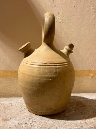 Photo for A clay jug called botijo in spanish. A traditional mud jar used to keep fresh water inside. - Royalty Free Image