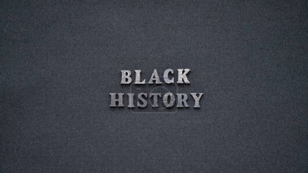 Photo for Inscription text Black History Month on dark isolated background close up. Celebrating the African American Conceptual Holiday for Equality - Royalty Free Image