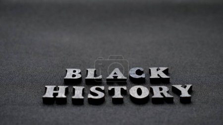Photo for Inscription text Black History Month on dark isolated background close up. Celebrating the African American Conceptual Holiday for Equality - Royalty Free Image