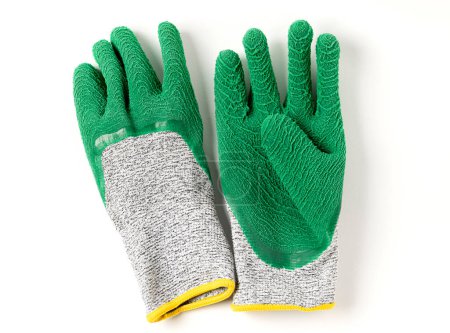 Photo for View from above of green very high cut resistance gloves covered with crinkled latex on white background. - Royalty Free Image