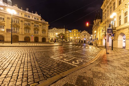 Cobbled Lesser Town Square by night in Prague, Czechia