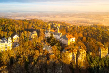 Hruba Skala chateau at cold morning sunrise time. Bohemian Paradise, Czech: Cesky raj, Czechia. Aerial view from above.