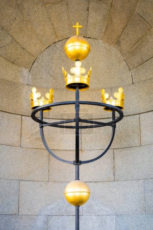 The emblem of Three Crowns representing Sweden national symbol, mounted at Tre Kronor Museum in Stockholm, denotes historical royalty and heritage. Sweden