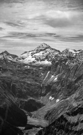 Majestic alpine landscape with glacier mountain of Tauernkogel. Hohe Tauern mountain range. Austrian Alps, Austria. Black and white image.