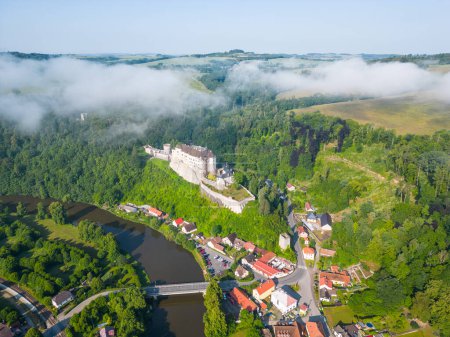 Cesky Sternberk castle and town at Sazava River on sunny summer morning. Aerial view from drone.