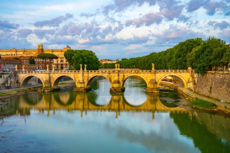 A view of the Bridge of Angels, Italian: Ponte Sant Angelo, crossing the Tiber River in Rome, Italy. The bridge is a popular tourist destination.