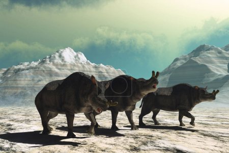 Téléchargez les photos : Trois mammifères Brontotherium s'émerveillent à travers un paysage montagneux à la recherche d'eau et de végétation. - en image libre de droit