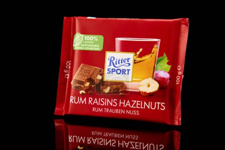 Photo for Bar of Ritter Sport chocolate. Rum raisins haselnuts flavor chocolate on black background. Wroclaw, Poland - December 28, 2022 - Royalty Free Image