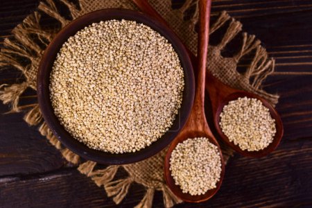 Healthy white quinoa seeds, healthy eating habits and balanced nutrition concept. Flat lei.
