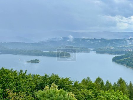 Lake Solina is a largest in Poland water reservoir surrounded by a characteristic landscape of mountains covered with forest and plenty of beaches with tourist infrastructure.