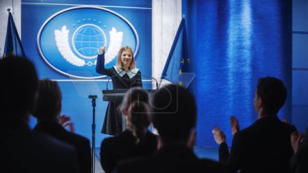 Photo for Young Girl Activist Delivering an Emotional and Powerful Speech at Press Conference in Government Building. Child Speaking to Congress at Summit Meeting. Backdrop with European Union Flags. - Royalty Free Image