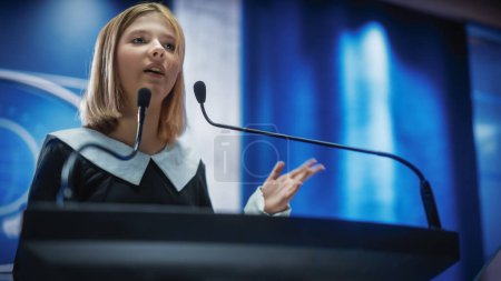 Photo for Portrait of an Young Girl Activist Delivering an Emotional and Powerful Speech at a Press Conference in Government Building. Child Speaking to Congress at Summit Meeting with World Leaders. - Royalty Free Image