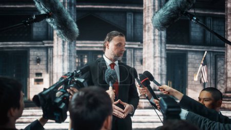 Photo for Organization Representative Answering Press Questions and Giving Interview Outside a Parliament, Court or Other Government Building. Press Officer or Businessman Crowded by News Journalists. - Royalty Free Image