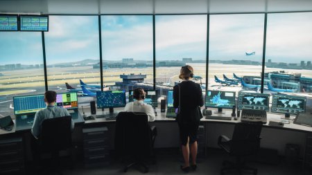 Photo for Diverse Air Traffic Control Team Working in a Modern Airport Tower. Office Room is Full of Desktop Computer Displays with Navigation Screens, Airplane Flight Radar Data for Controllers. - Royalty Free Image