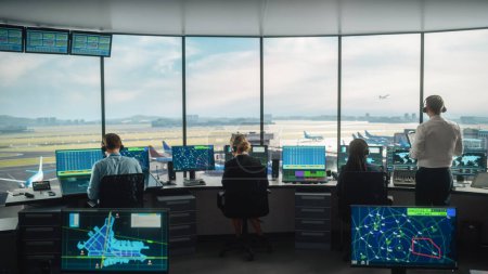 Photo for Diverse Air Traffic Control Team Working in a Modern Airport Tower. Office Room is Full of Desktop Computer Displays with Navigation Screens, Airplane Flight Radar Data for Controllers. - Royalty Free Image