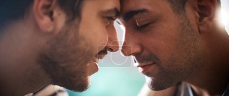 Photo for Authentic Close Up Shot of a Stylish Handsome Young Adult Gay Couple Spend Time at Home. Two Happy Men in Love in Casual Clothes Make a Gentle Headbutt. Cute LGBT Relationship Content. - Royalty Free Image