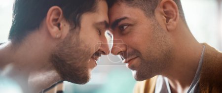 Photo for Authentic Close Up Shot of a Stylish Handsome Young Adult Gay Couple Spend Time at Home. Two Happy Men in Love in Casual Clothes Make a Gentle Headbutt. Cute LGBT Relationship Content. - Royalty Free Image