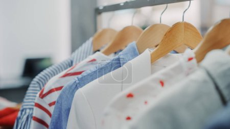 Photo for Close Up Shot of Clothing Rack with Colorful Stylish Items. Shopping Center Interior. Modern Fashionable Shop, Clothes for Every Taste. Fashionable Design, Quality Sustainable Materials. No People. - Royalty Free Image