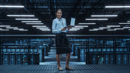Photo for Portrait of a Female Data Center Engineer Using Laptop Computer. Server Room Specialist Facility with Multiethnic System Administrator Working with Data Protection Network for Cyber Security. - Royalty Free Image