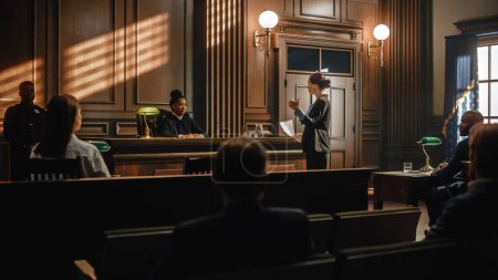Photo for Court of Justice and Law Trial: Successful Female Prosecutor Presenting the Case, Making Passionate Speech to Judge, Jury. Attorney Lawyer Protecting Client with Closing Not Guilty Arguments. - Royalty Free Image