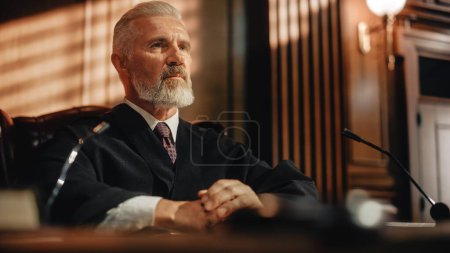 Court of Law and Justice Trial: Portrait of Impartial Male Judge Listening To the Pleaded Case. Unbiased Decision after Hearing Arguments. Deliberation on Guilty, Not Guilty Verdict