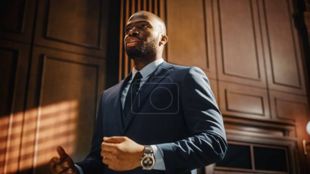 Photo for Court of Justice and Law Trial: Successful Male Public Defender Presenting the Case, Making Passionate Speech to Judge, Jury. Attorney Lawyer Protecting Client with closing Not Guilty Arguments - Royalty Free Image