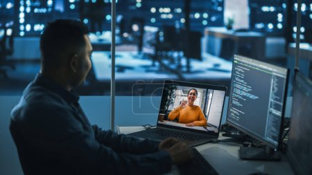 Photo for Remote Teamwork In Office at Night: Project Manager Talks with Creative Solutions Specialist Via Video Conference Call. International Startup Company Specialists Doing Online Meeting to Brainstorm - Royalty Free Image