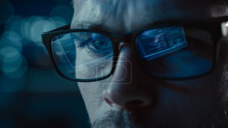 Photo for Close-up Portrait of Software Engineer Working on Computer, Line of Code Reflecting in Glasses. Developer Working on Innovative e-Commerce Application using Machine Learning, AI Algorithm, Big Data - Royalty Free Image
