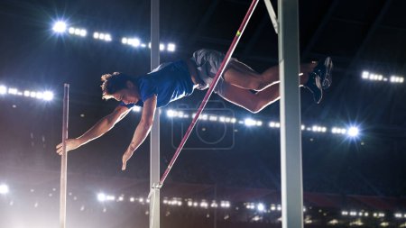 Pole Vault Jumping: Professional Male Athlete on World Championship Successfully Jumping with Pole over Bar. Shot of Competition on Big Stadium with Sports Achievement Experience