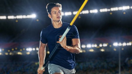 Stabhochspringen: Portrait eines männlichen Profisportlers auf dem WM-Lauf mit dem Stab über die Stange. Wettkampfschuss im großen Stadion mit sportlicher Erfolgserfahrung
